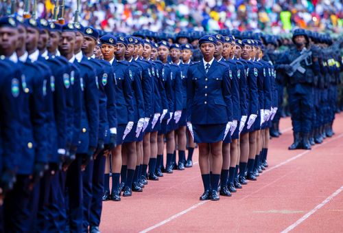 Free Rwandan police officers lined up in uniform formation during a ceremonial parade outdoors. Stock Photo