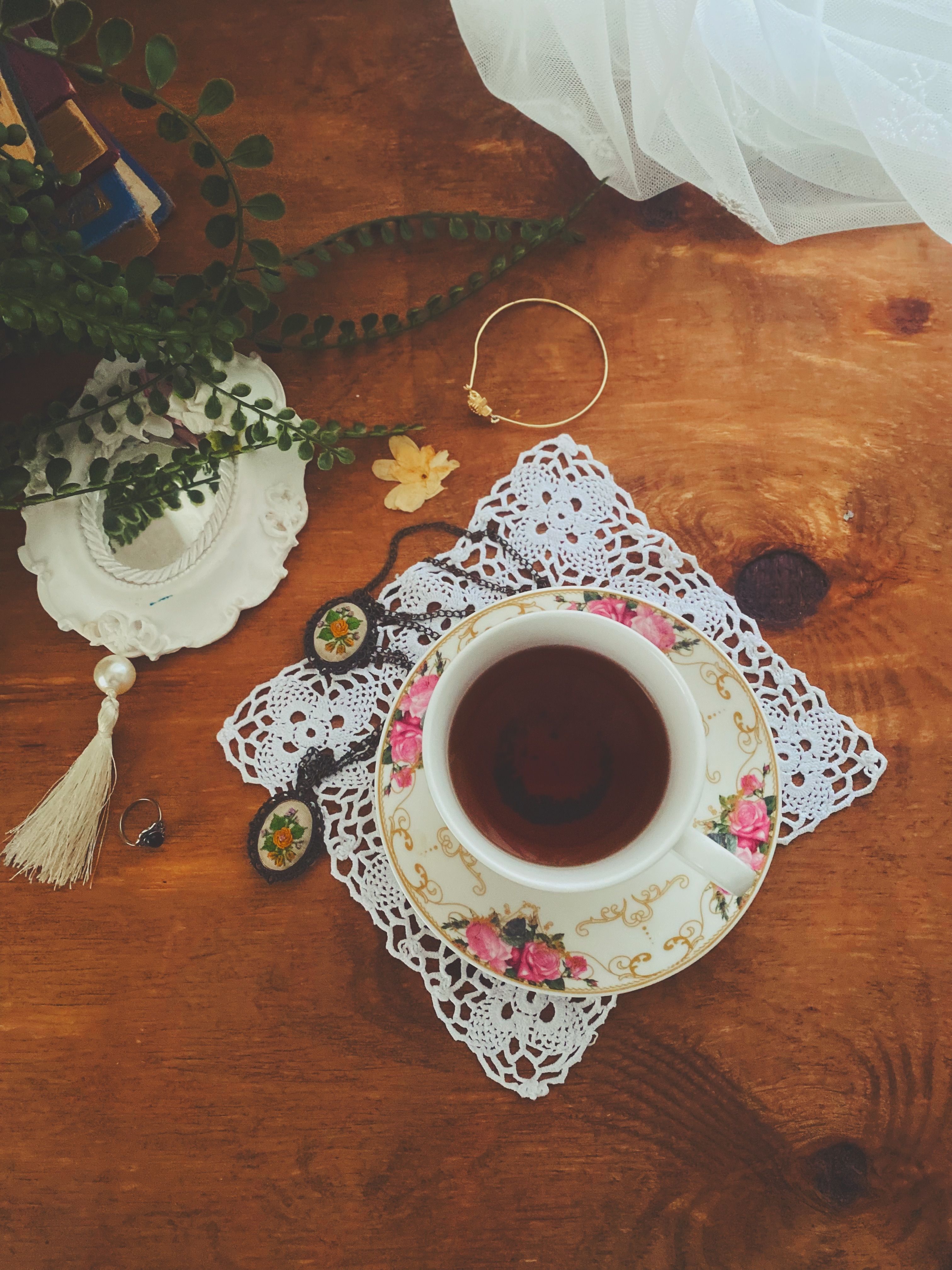 Vintage Tea Setup with Floral Cup and Doily · Free Stock Photo