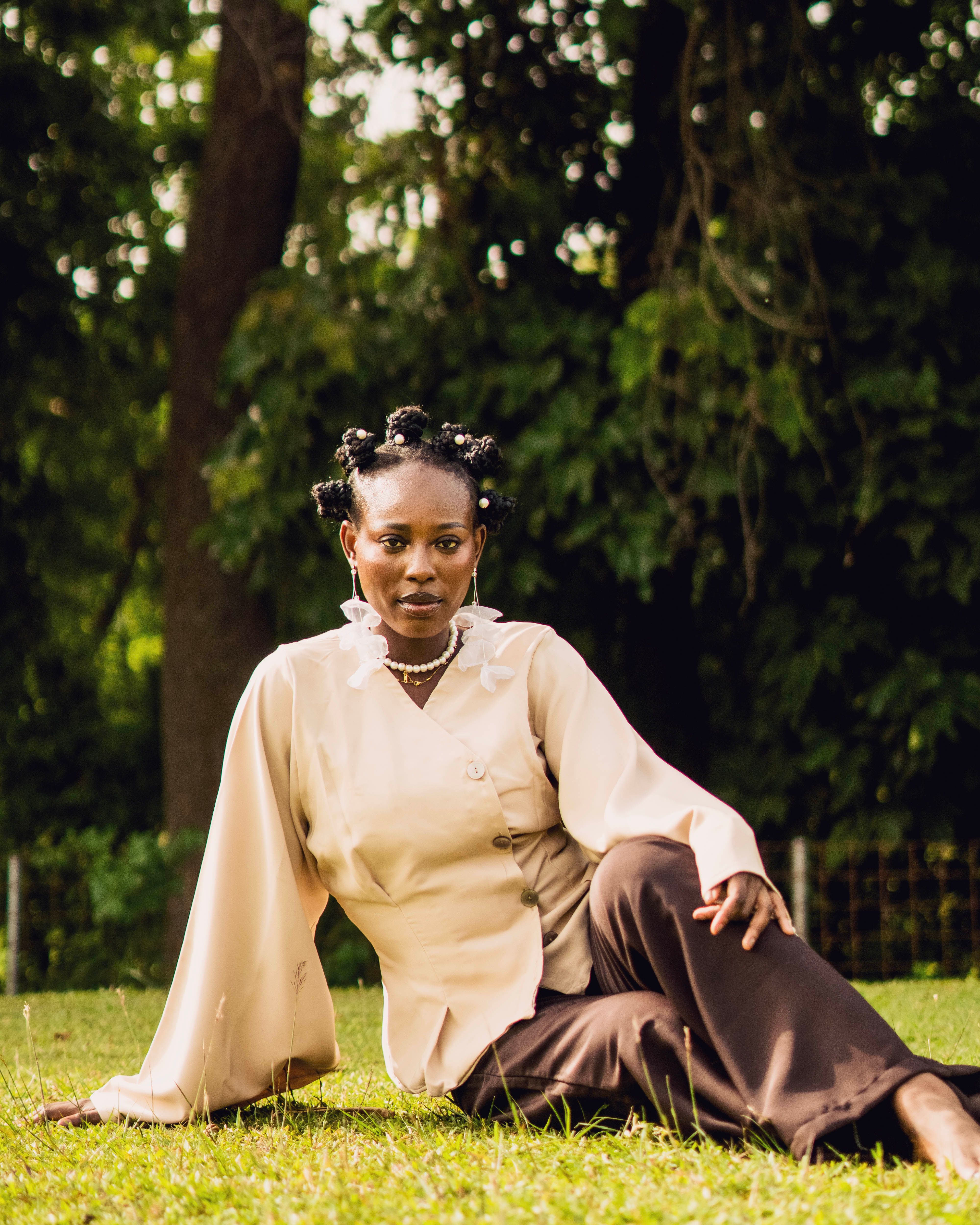 Elegant Woman Posing Outdoors in Stylish Attire · Free Stock Photo