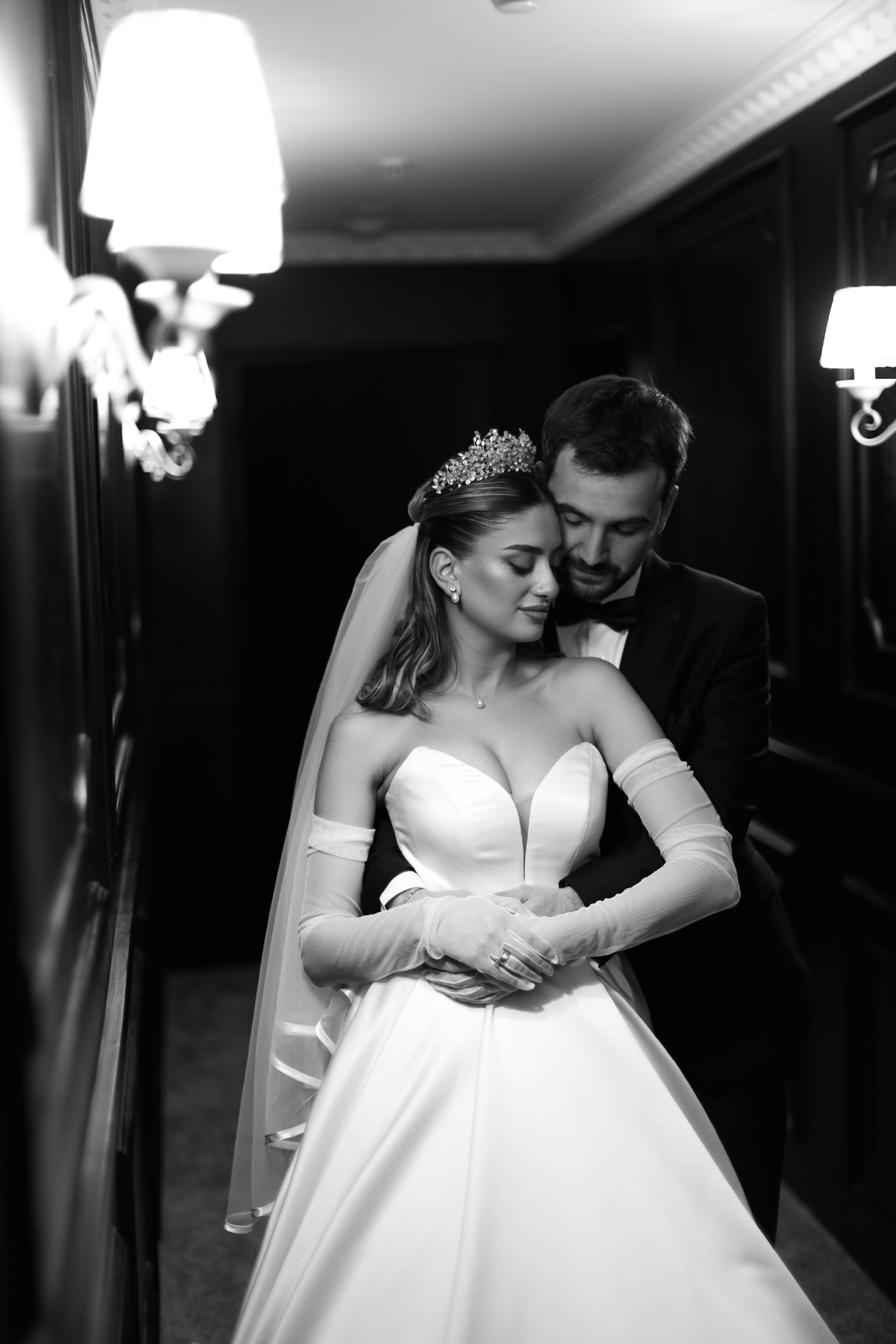 A classic black and white wedding photo capturing a romantic couple.