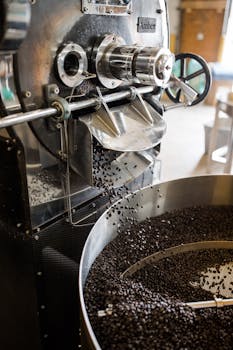Close-up of coffee beans roasting in an industrial machine in Greensboro, North Carolina.