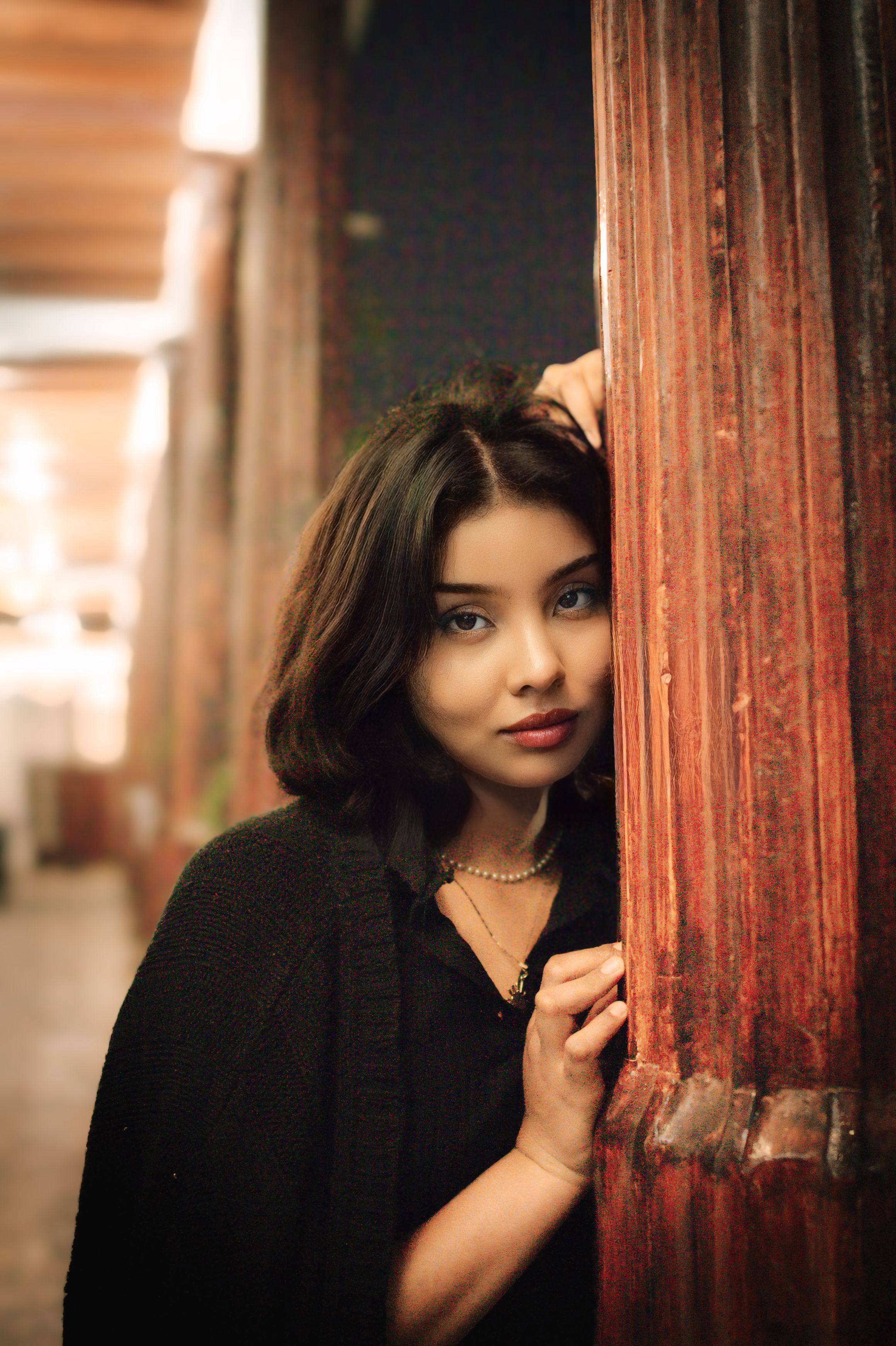 Portrait of a Woman in a Rustic Indoor Setting · Free Stock Photo