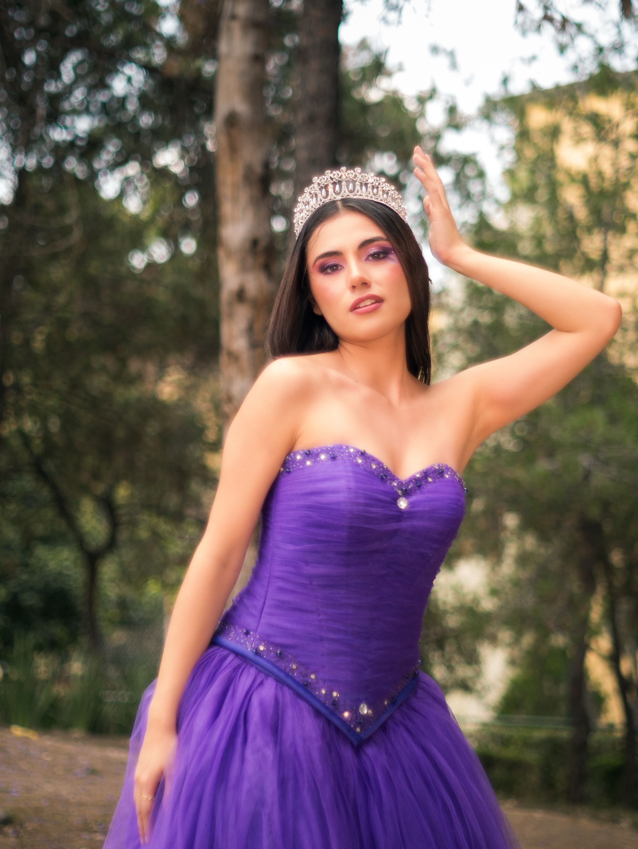 Elegant Young Woman in Purple Gown Outdoors · Free Stock Photo