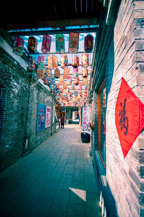 Free Vibrant alley with ornate Chinese lanterns and traditional architecture. Stock Photo