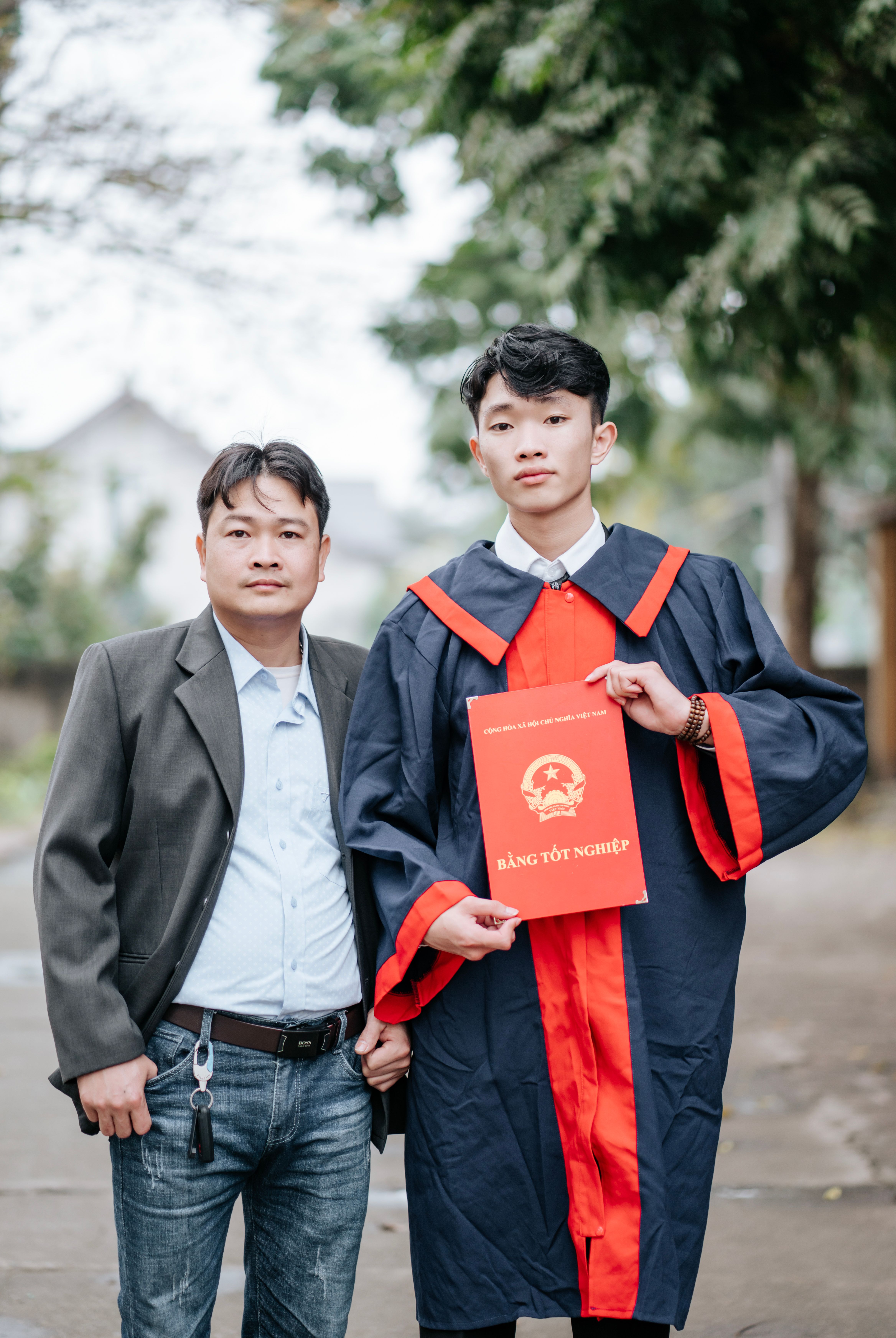 Graduation Ceremony: Proud Moment with Diploma · Free Stock Photo