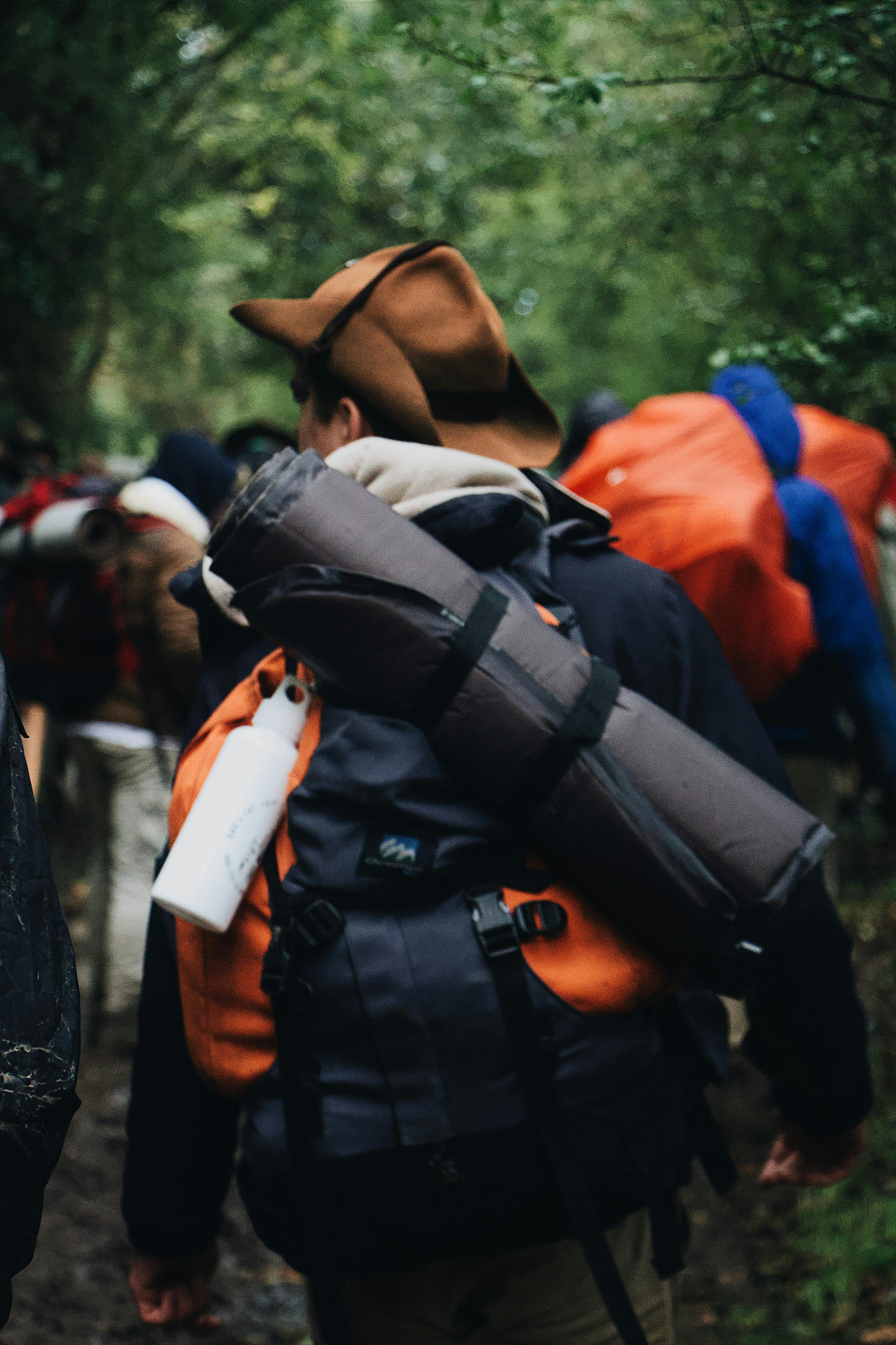 Man Carrying Bag and Blanket · Free Stock Photo