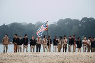 Men Standing Beside Body of Water