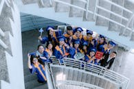 Graduation Ceremony Group Photo on Spiral Staircase