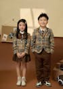 Cute Children in School Uniform Indoors