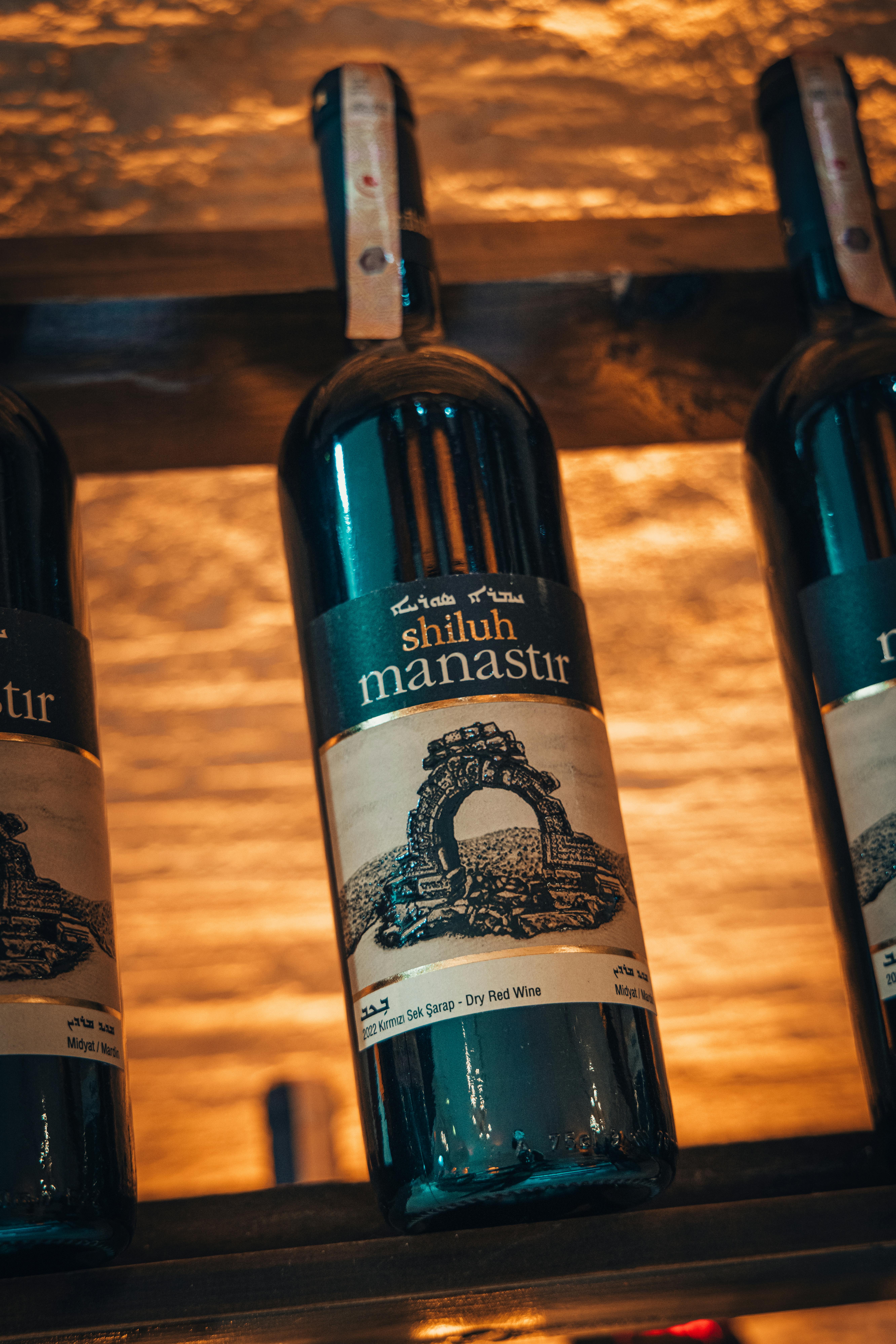 Elegant bottles of red wine beautifully displayed, perfect for wine enthusiasts.
