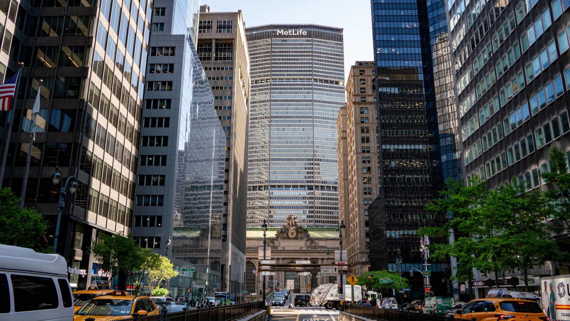 Dynamic view of Grand Central Terminal and MetLife Building in Manhattan, capturing urban life and architecture.