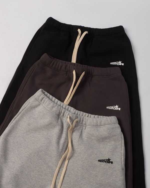 Stylish Stack of Three Colorful Sweatpants · Free Stock Photo