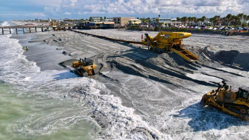 Free Aerial view of beach construction with machinery at Flagler Beach, FL. Stock Photo