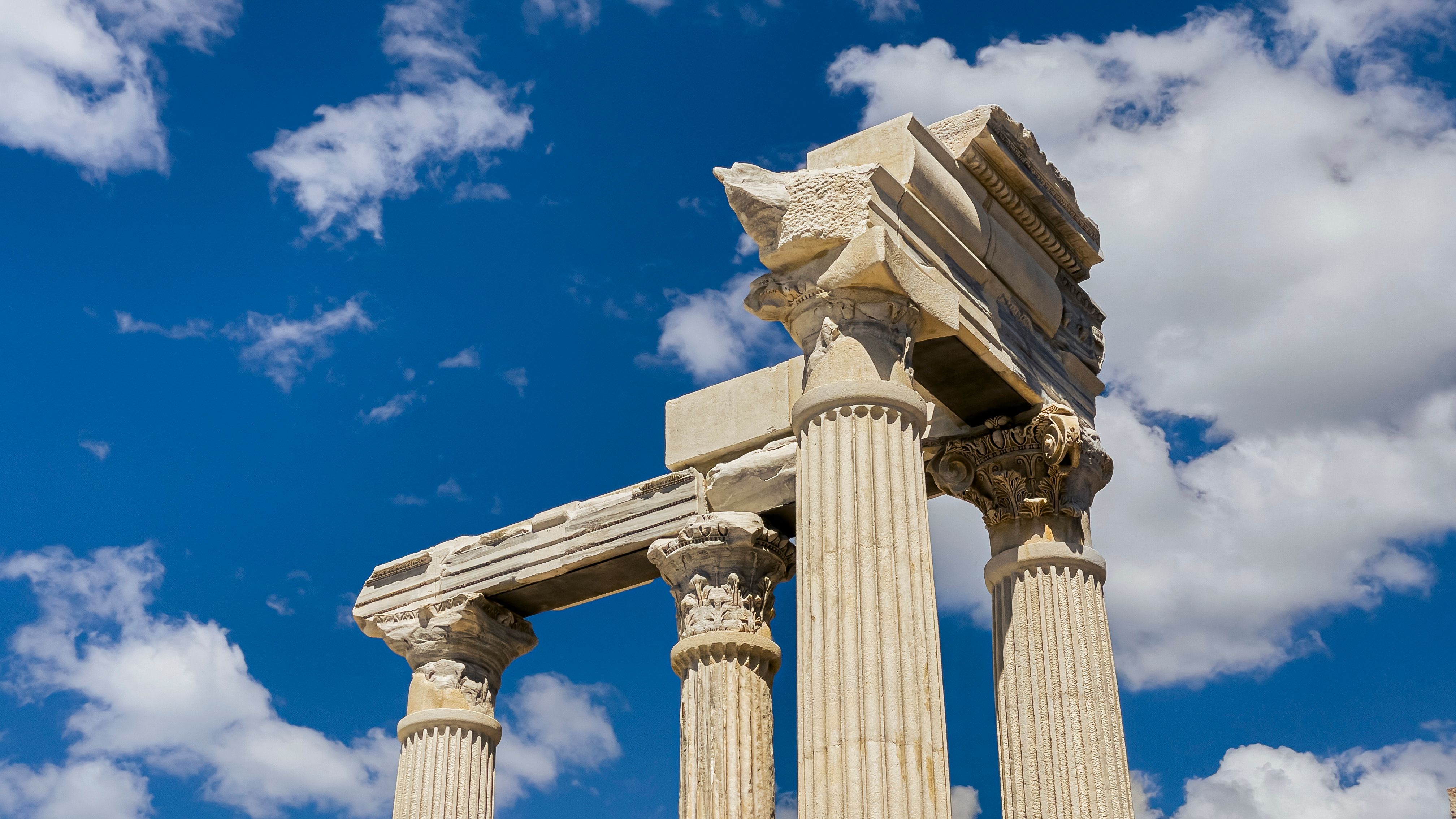 Ancient Roman Temple Ruins Against Blue Sky · Free Stock Photo