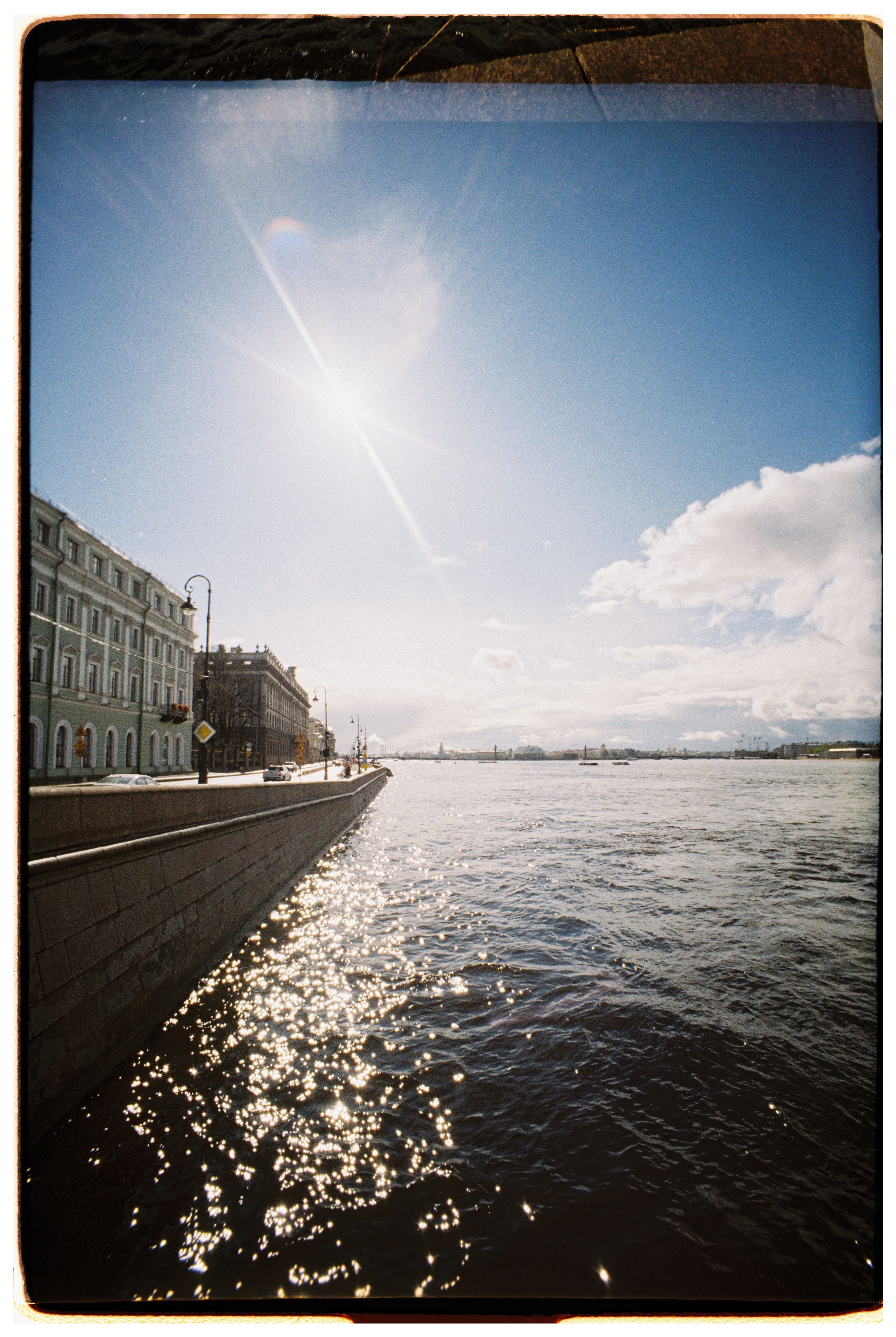 Scenic Riverfront View with Clear Blue Sky · Free Stock Photo