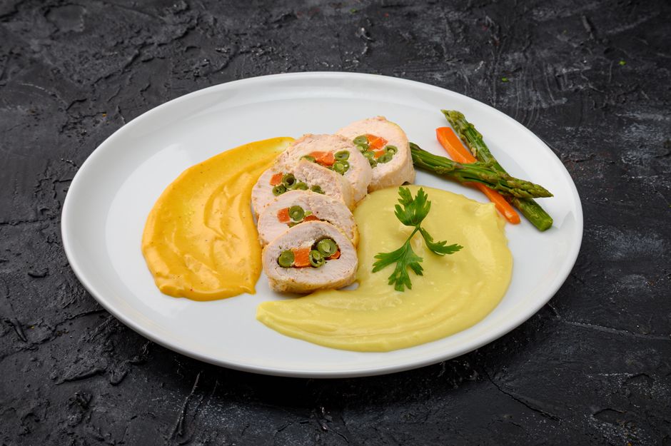 Photo by Christopher Welsch Leveroni on Pexels Sliced chicken roulade with vegetable filling served with dual purees and asparagus. - Photo by Christopher Welsch Leveroni on Pexels