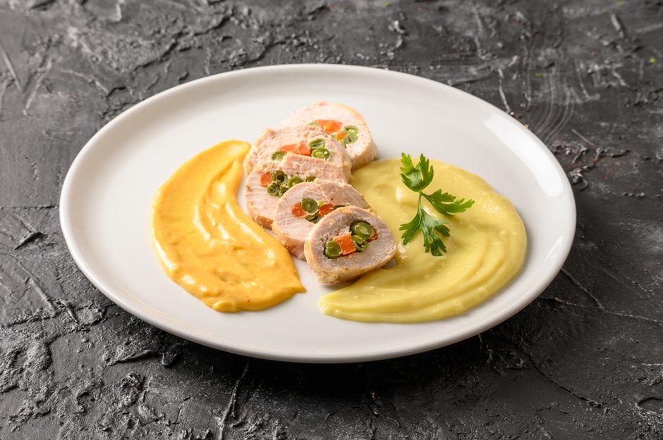 Photo by Christopher Welsch Leveroni on Pexels Exquisite Peruvian chicken dish garnished with purees and vegetables, capturing gourmet dining essence. - Photo by Christopher Welsch Leveroni on Pexels