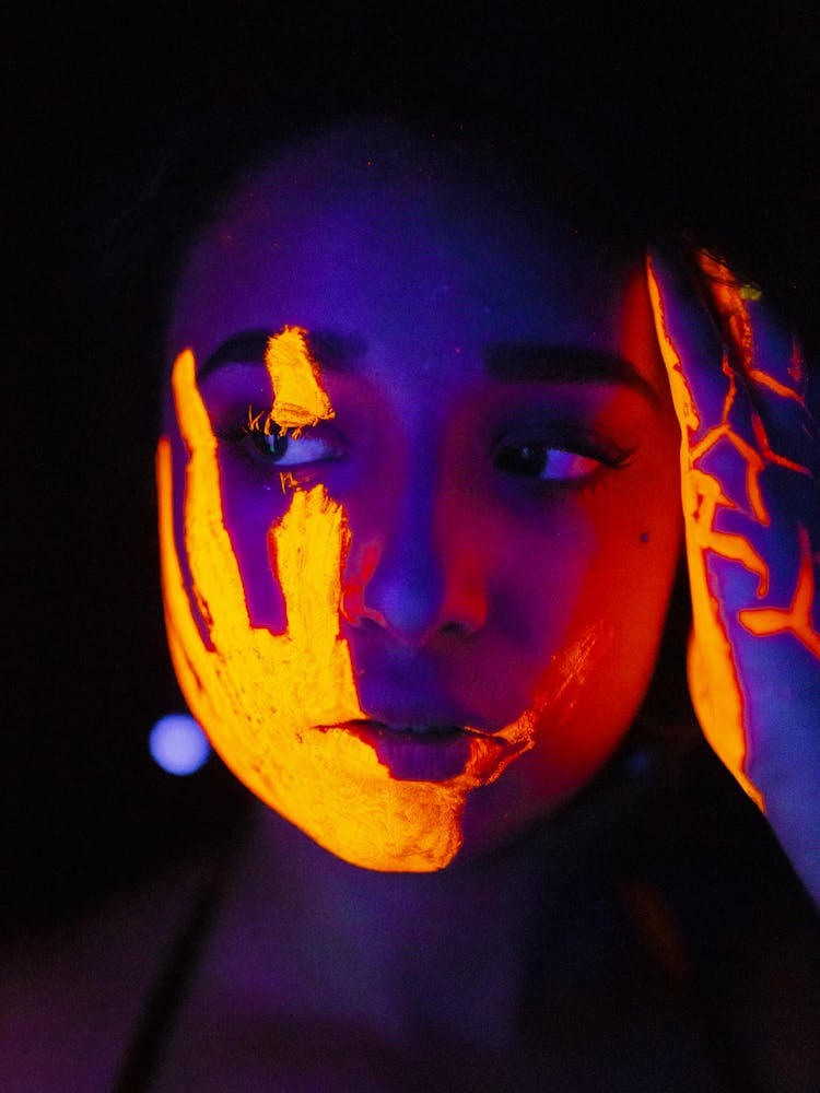 Woman With Hand Paint On Face