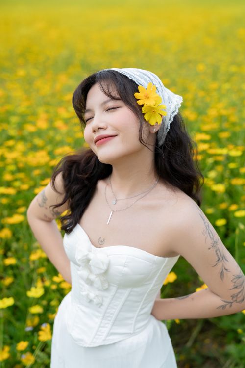 Woman in White Dress Enjoying Flower Field  Free Stock Photo