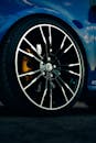 Close-Up of Stylish Car Wheel on Blue Vehicle