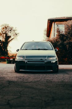 Rugged car front with a scenic outdoors rustic setting. Ideal for auto enthusiasts.