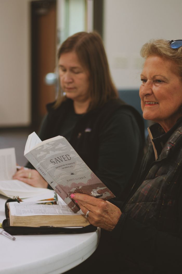 A small Bible study group reading together