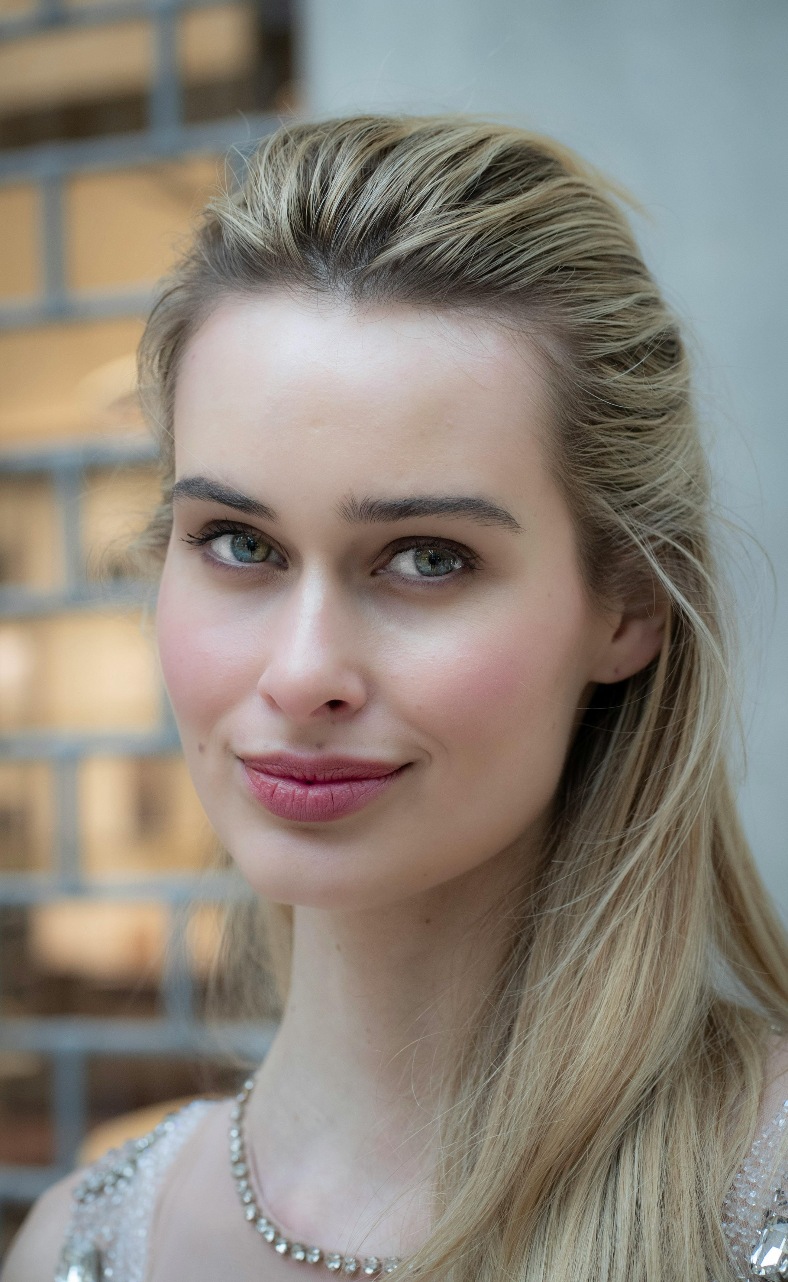 Close-up photo of a stylish adult female model outdoors in Milan, Italy.