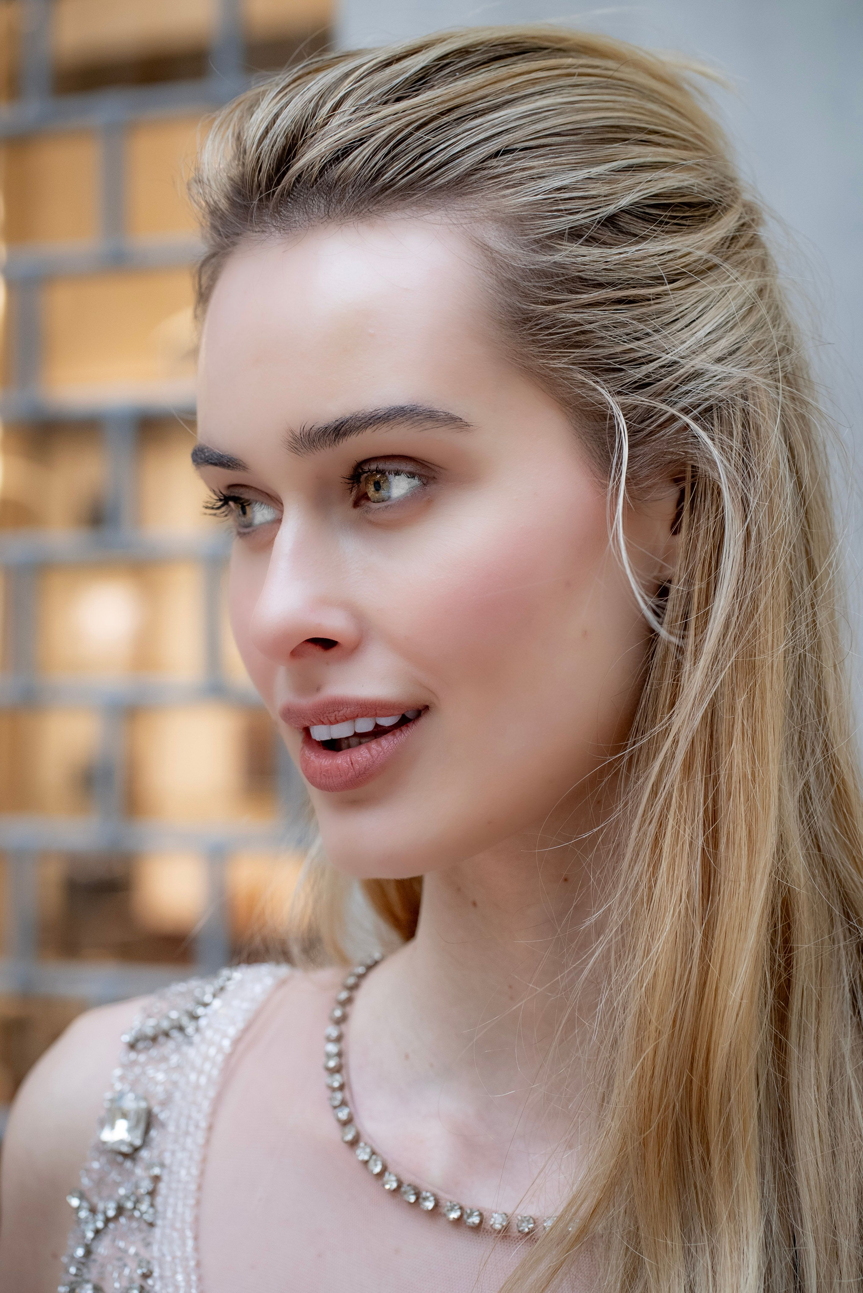 Portrait of a stylish female model smiling in Milan, Italy.