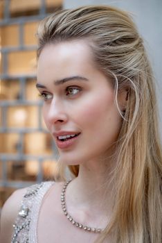 Portrait of a stylish female model smiling in Milan, Italy.