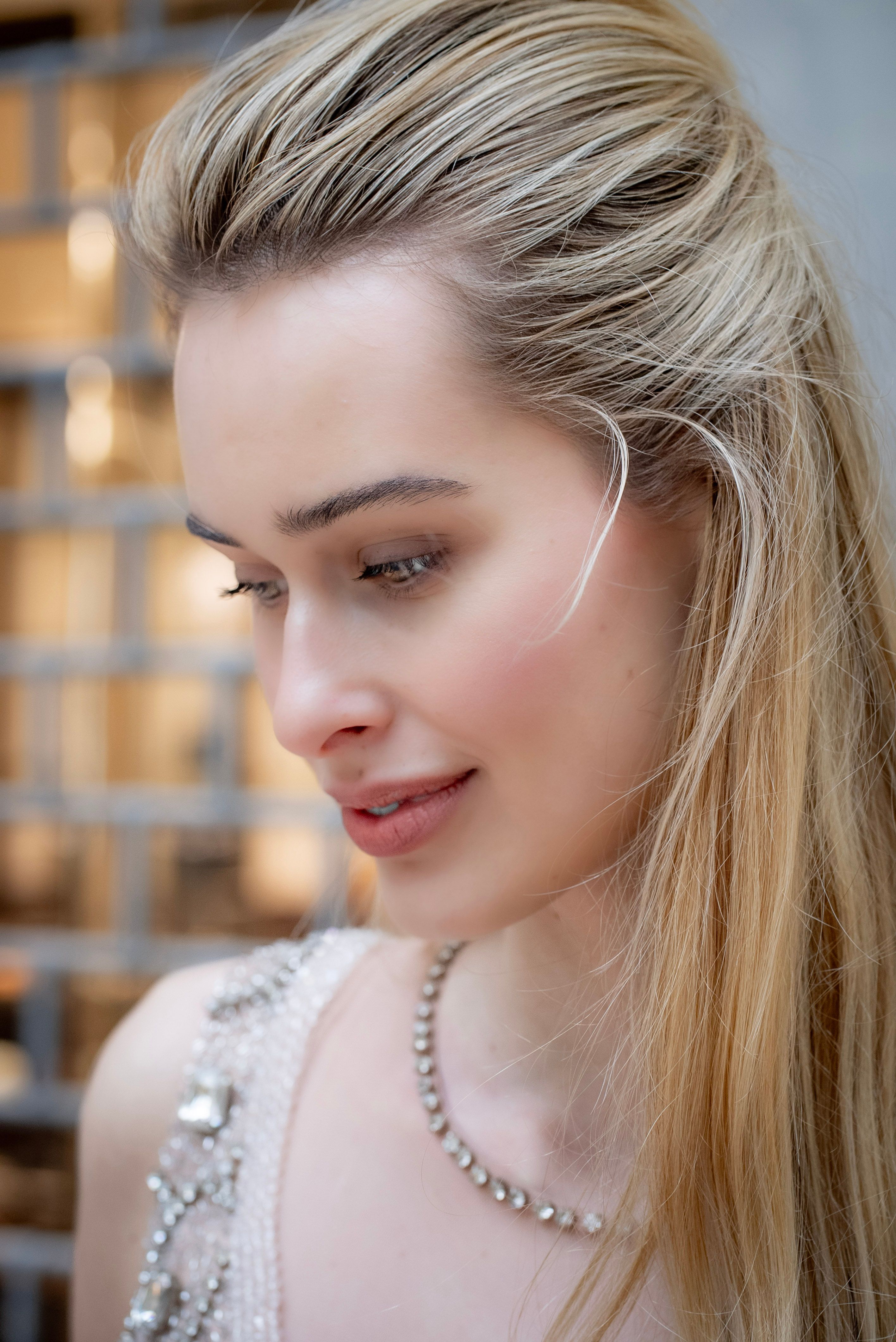 Close-up portrait of an elegant caucasian woman in Milan, capturing fashion and beauty.