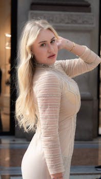 Stylish portrait of a woman posing in elegant attire, captured in Milan, Italy.