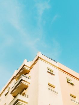 A beige building in Rabat with clear blue skies representing contemporary Moroccan urban architecture.