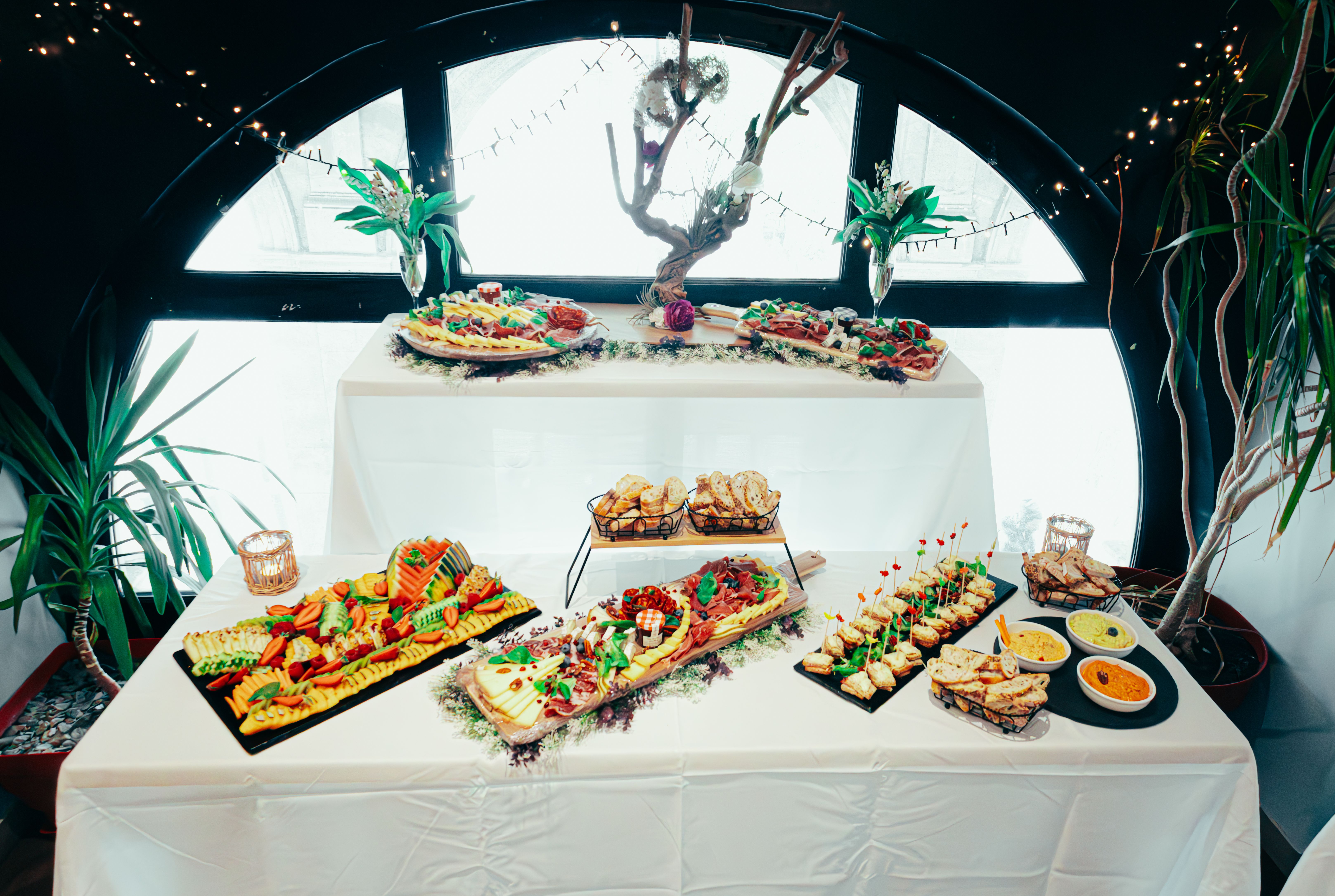 Stylish indoor buffet display with gourmet appetizers and elegant decoration