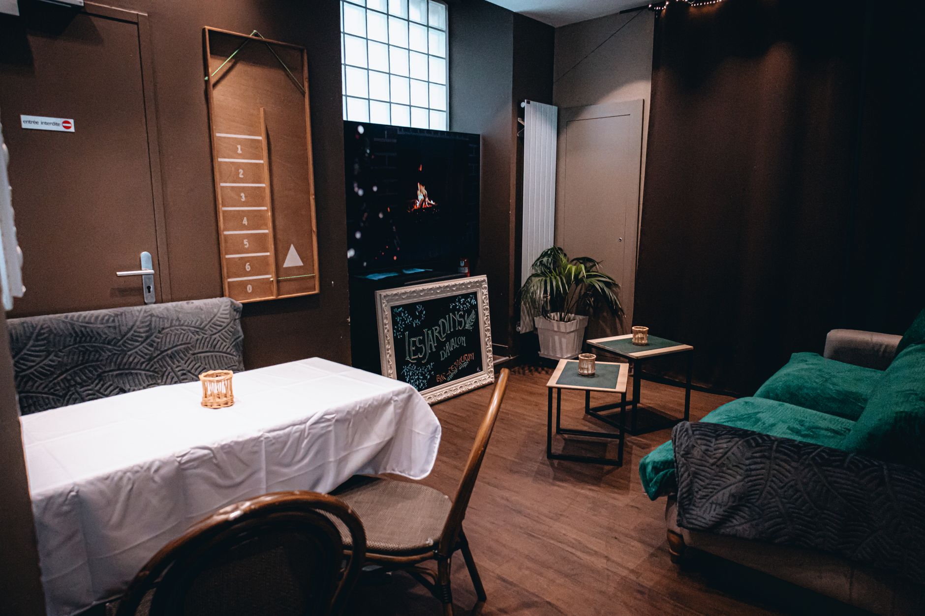 Charming indoor lounge with cozy seating and stylish decor, perfectly set for a relaxing gathering.