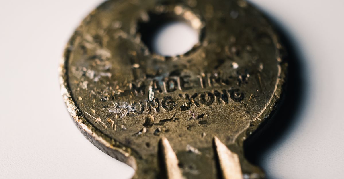 Key Inscription Close-up of an Old Rusty Key with Text · Free Stock Photo