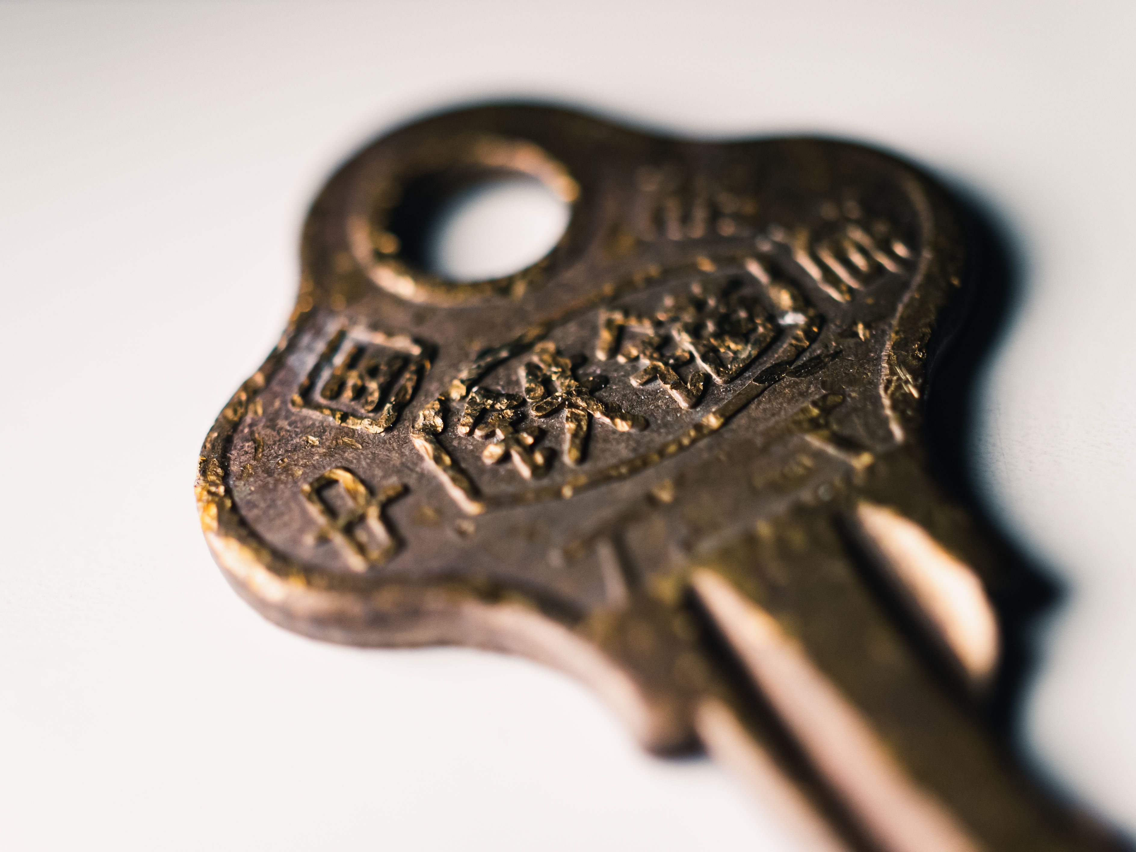 Close-up of a Vintage Brass Key with Text · Free Stock Photo
