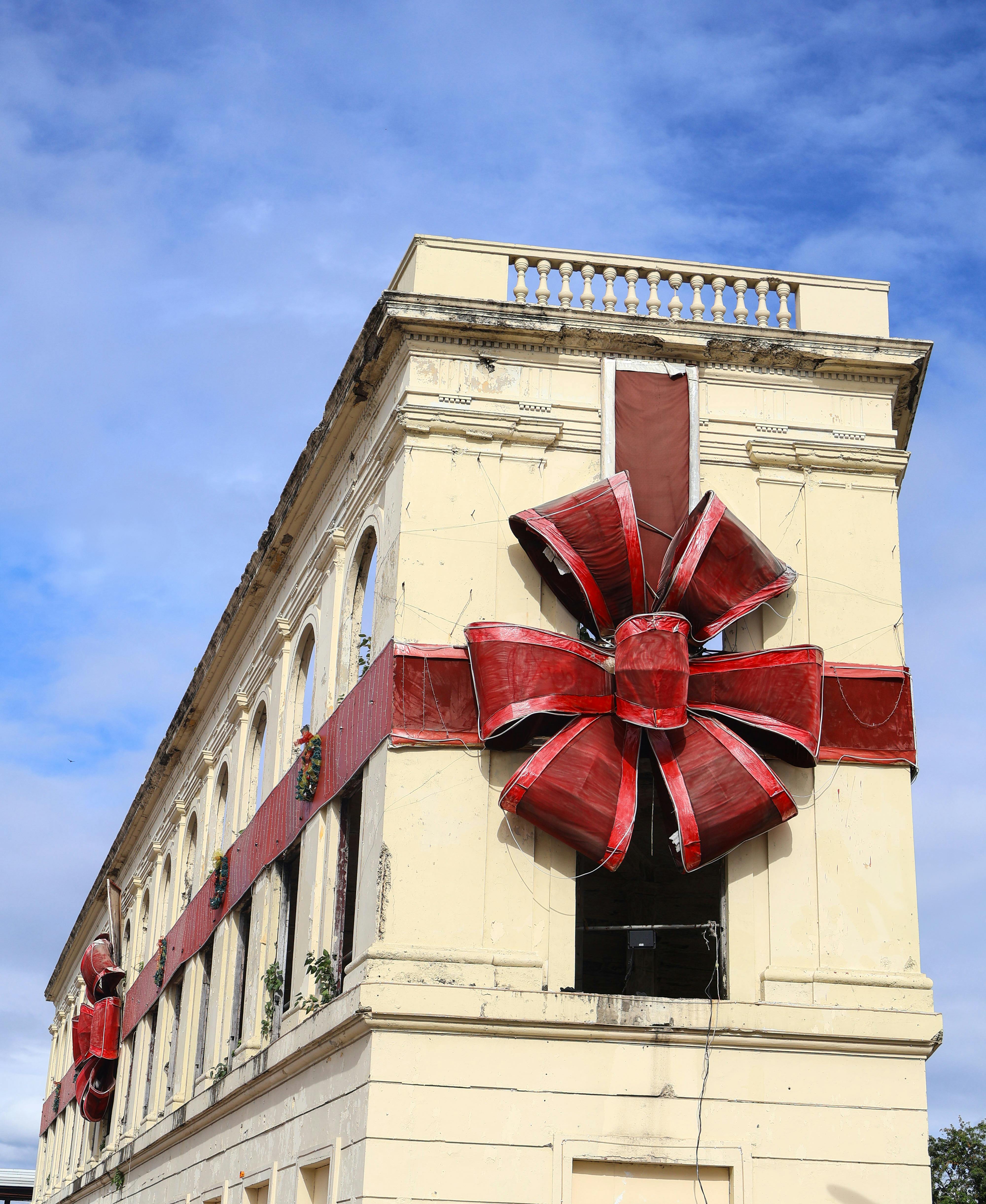 vintage building decorated with bright red ribbon
