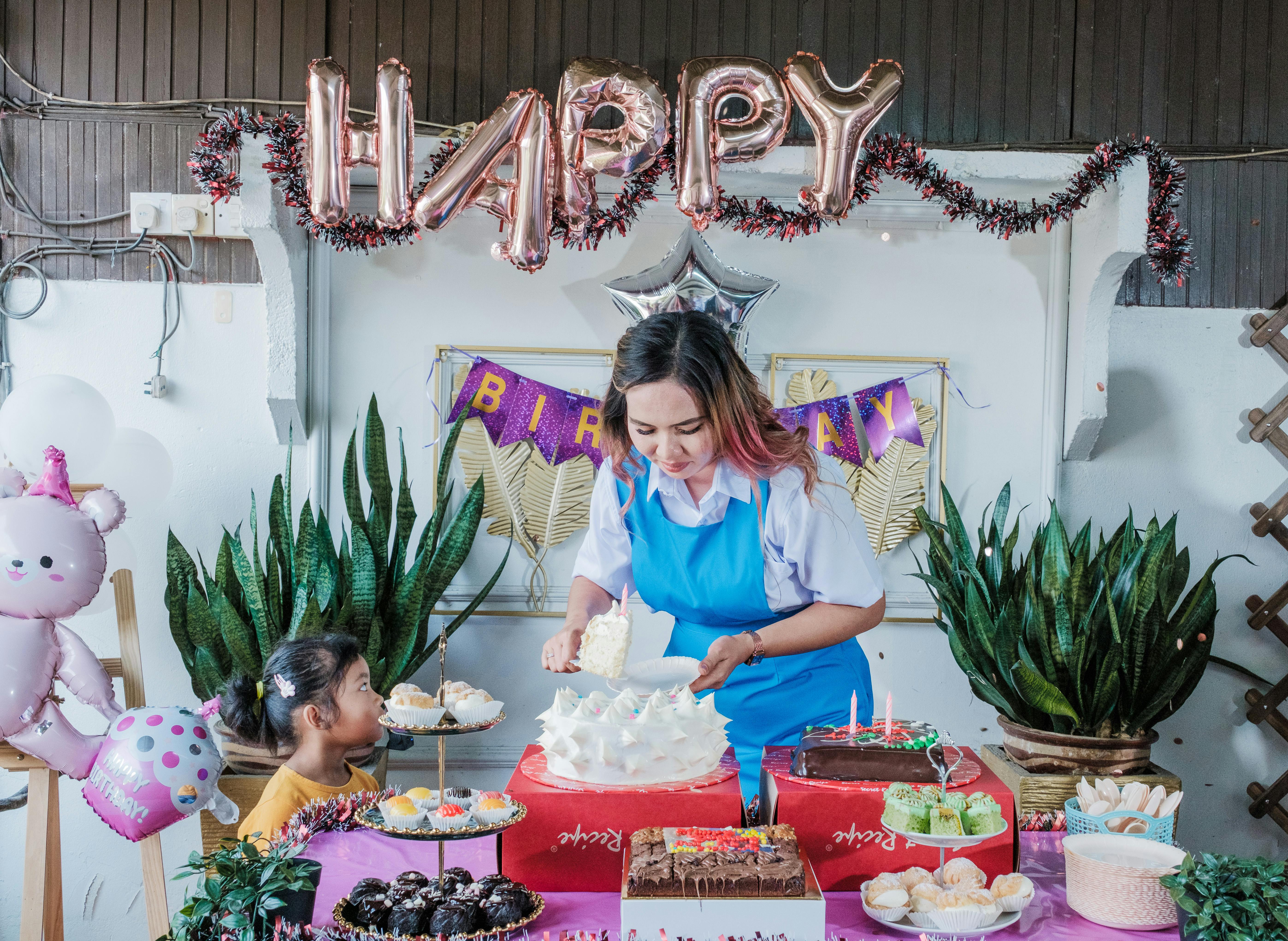 A lively indoor birthday party with cakes, balloons, and decorations. Perfect for festive and family celebrations imagery.
