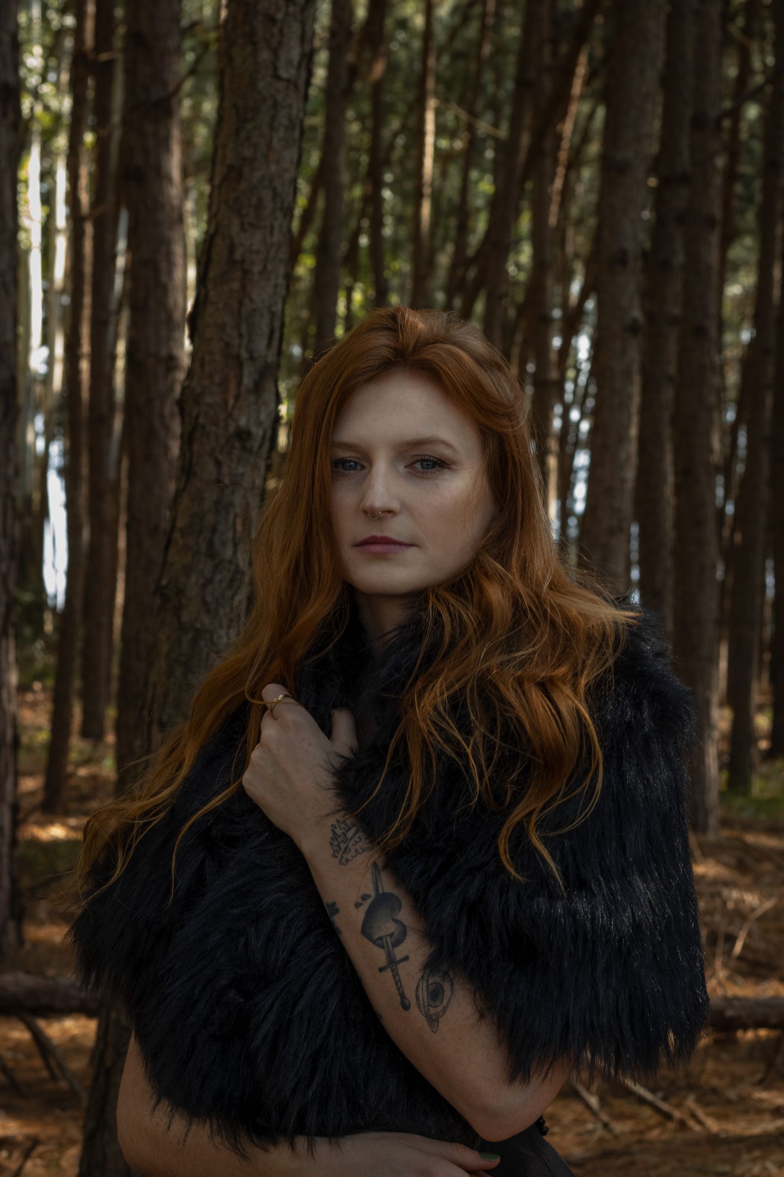 Woman with Red Hair Smiling in Forest Setting · Free Stock Photo