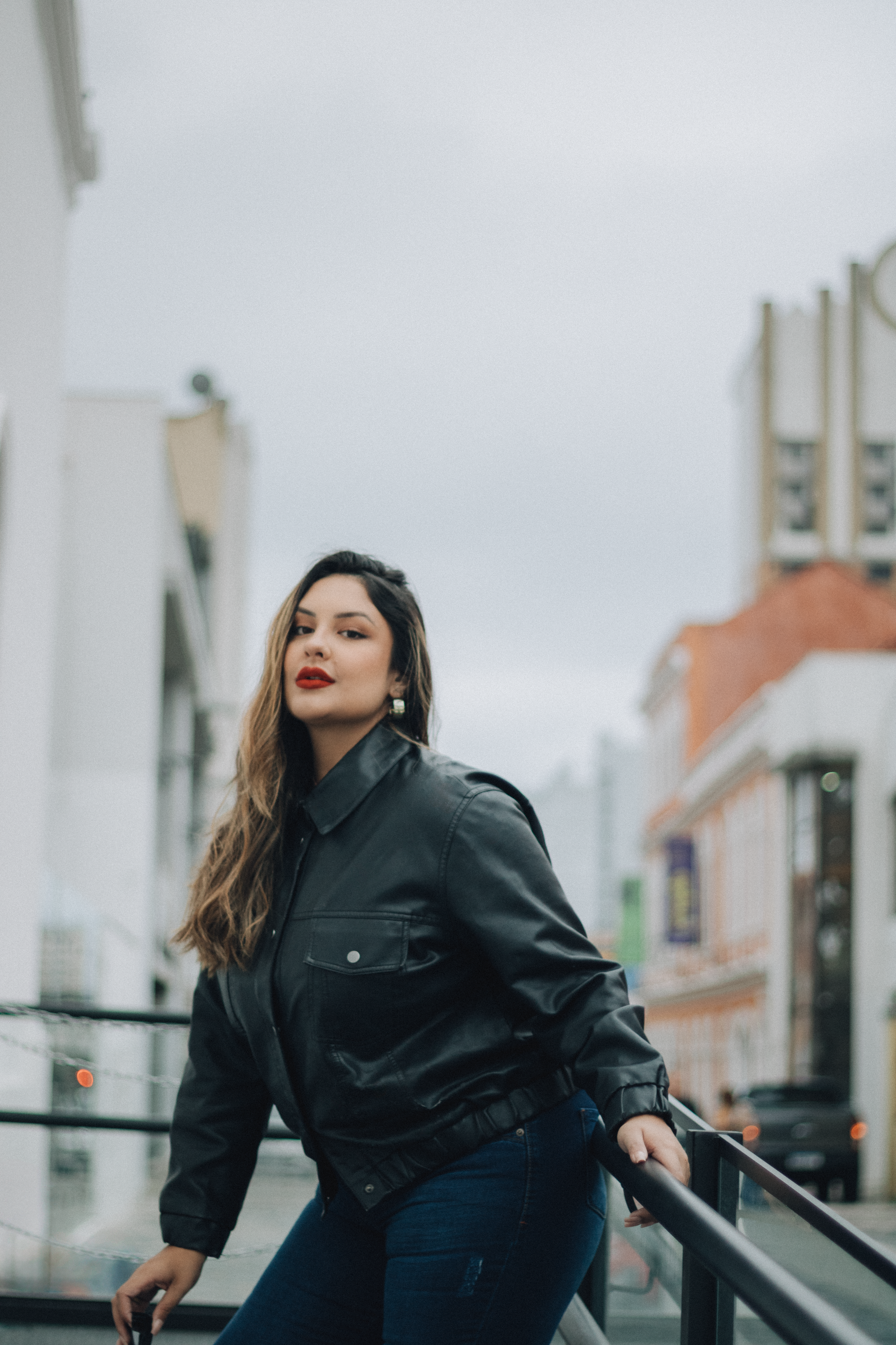 Woman in Black Leather Jacket and Denim Jeans Standing Beside a Yellow ...