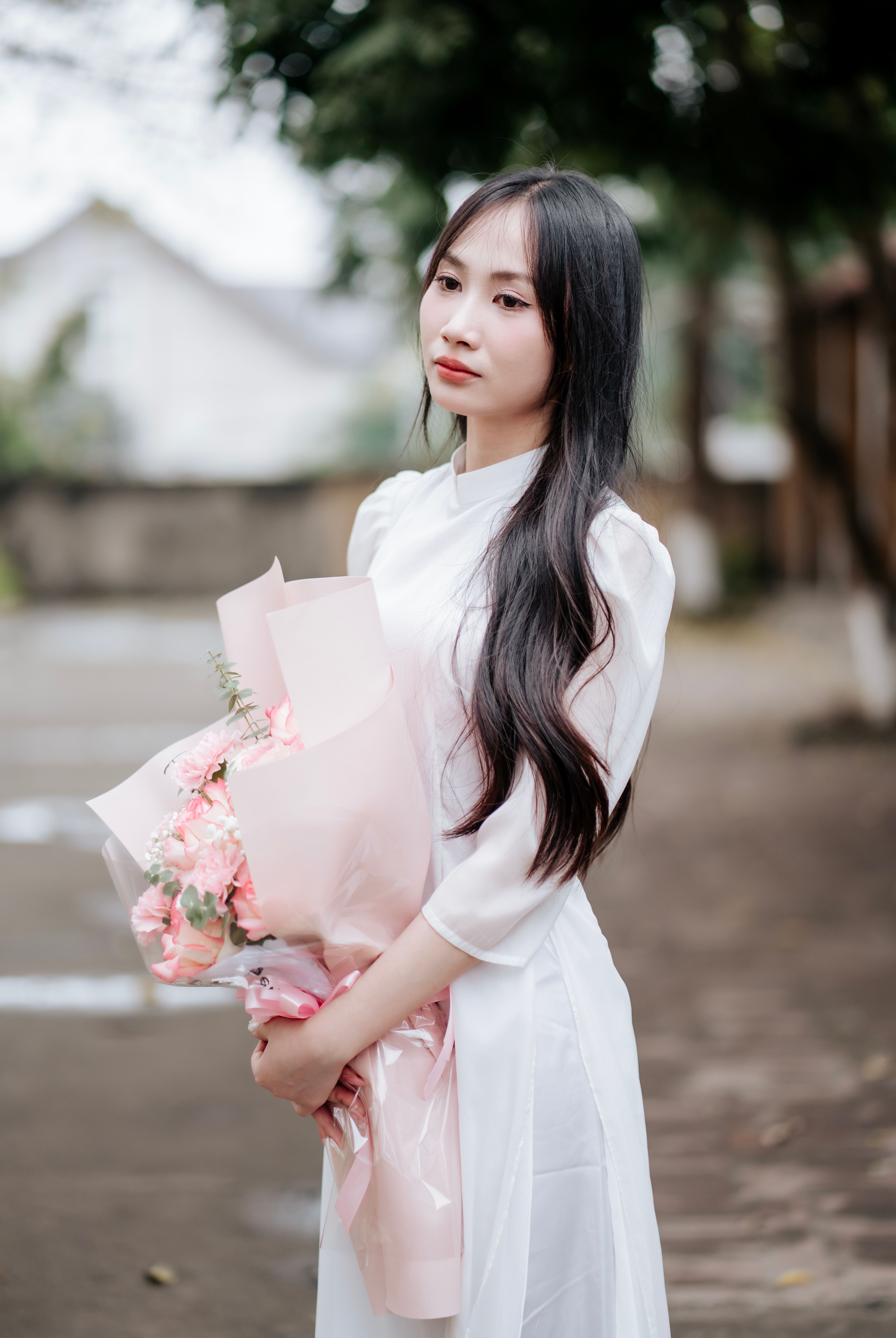 Portrait of Woman in Traditional Dress with Flowers · Free Stock Photo