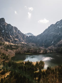 Beautiful alpine lake nestled in the Austrian mountains, offering a tranquil and breathtaking landscape view.