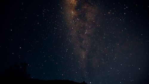 Free Breathtaking long exposure shot of the Milky Way over Mount Rinjani, Indonesia. Stock Photo