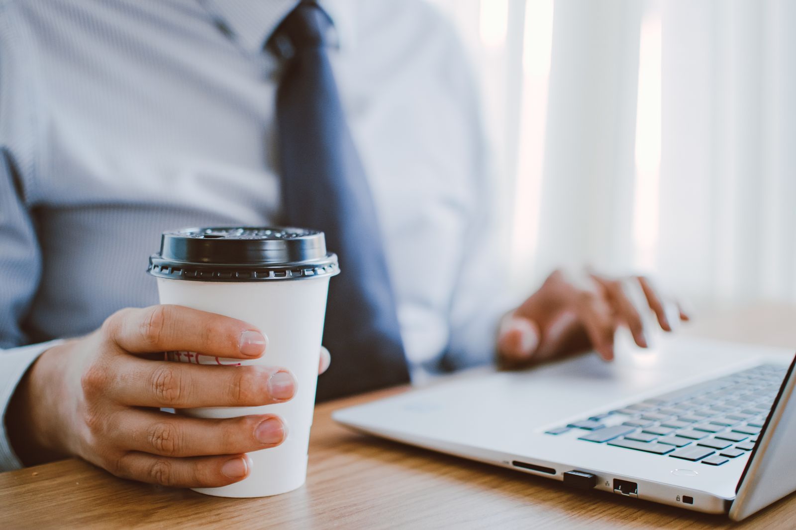UK small business owner choosing an affordable web designer and reviewing website contract terms