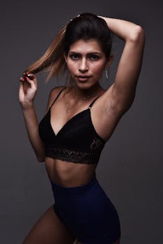 Stylish portrait of a woman posing confidently in athletic attire.