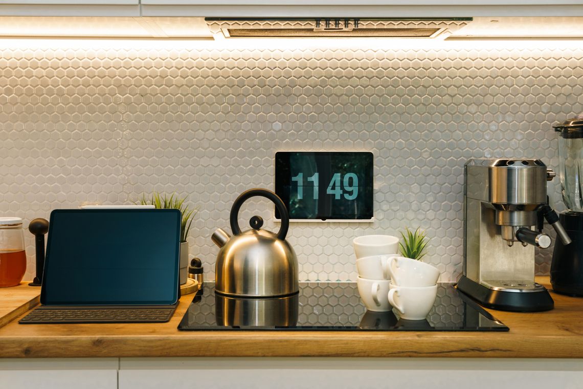 Stylish modern kitchen counter with smart appliances and coffee equipment