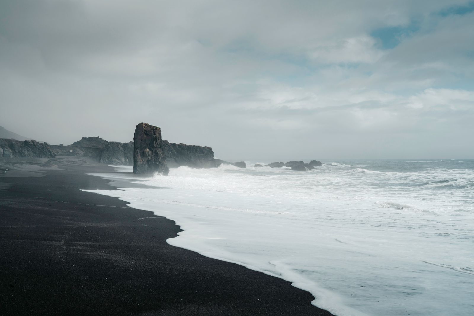 Reynisfjara black sand beach and basalt sea stacks, Vík, Iceland