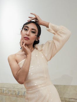 Chic portrait of a woman elegantly posing in a stylish sequin dress.