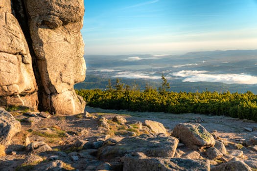 Breathtaking landscape of Karkonosze mountains with vibrant sunrise lighting, outdoors in Województwo dolnośląskie, Poland.