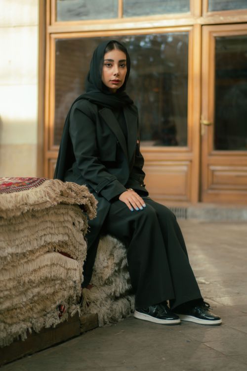 Free Stylish portrait of a woman in Tehran, showcasing modern fashion with a traditional touch. Stock Photo